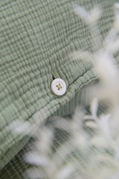 Housse de coussin en mousseline Jula vert fougère